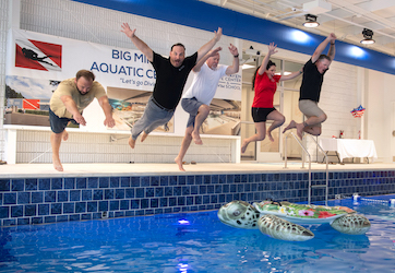 Big Mike's Aquatic Center: Christian Pittman, superintendent, Axis Global Enterprises; Ross Vierra, Axis CEO and president; David Pittman, Axis vice president of construction; Lindsey Hillier Hotchkiss, co-owner, Lynnhaven Dive Center; and Scott Hotchkiss, co-owner, Lynnhaven Dive Center; pose for a photo during the ceremonial opening of Big Mike’s Aquatic Center on June 16. (Courtesy of Lynnhaven Dive Center)